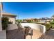 View of the neighborhood from the patio with seating area and privacy wall at 26485 W Yukon Dr, Buckeye, AZ 85396