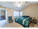 This bright bedroom has vaulted ceilings, neutral paint, plush carpet, and a ceiling fan at 276 E Senna Way, San Tan Valley, AZ 85143