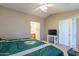 Main bedroom featuring a ceiling fan, an ensuite bathroom, and neutral paint at 276 E Senna Way, San Tan Valley, AZ 85143