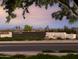 Community entrance showcasing lush landscaping and stone wall, sign reading 'The Preservation' at 3294 W Storm Cloud St, San Tan Valley, AZ 85144