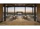 Outdoor dining area featuring seating for large parties with lighting for evening entertainment at 3294 W Storm Cloud St, San Tan Valley, AZ 85144