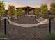 Relaxing hammock park featuring multiple hammocks, shade structure, seating, and trees at 3294 W Storm Cloud St, San Tan Valley, AZ 85144