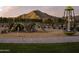Community playground features modern equipment and mountain views, perfect for active  at 3294 W Storm Cloud St, San Tan Valley, AZ 85144