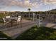 Community playground with picnic table offers a modern design and mountain views at 3294 W Storm Cloud St, San Tan Valley, AZ 85144