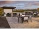 Outdoor lounge area with fire pits, seating, tables, and a large movie screen for community enjoyment at 3294 W Storm Cloud St, San Tan Valley, AZ 85144