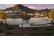Community outdoor water feature with modern water fountain, seating area, and pergola seating at 3294 W Storm Cloud St, San Tan Valley, AZ 85144