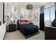 Stylish bedroom featuring unique comic-themed wallpaper, modern lighting, and a comfortable bed at 3307 W Storm Cloud St, San Tan Valley, AZ 85144