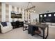 Modern bonus room with striped accent wall, wood beam lighting, and stylish decor throughout at 3307 W Storm Cloud St, San Tan Valley, AZ 85144