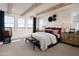 Bright main bedroom with wood beam ceiling, ample natural light, and views of the landscape at 3307 W Storm Cloud St, San Tan Valley, AZ 85144