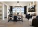 Office space featuring desk area, seating, modern lighting, and windows with views at 3391 W Sunstone Dr, San Tan Valley, AZ 85144