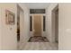 Bright foyer with a decorative front door, tile flooring, and neutral wall paint at 34435 N 68Th Way, Scottsdale, AZ 85262