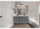 Stylish bathroom featuring double sink vanity, decorative mirror, and modern fixtures at 3595 E Desert Moon Trl, San Tan Valley, AZ 85143