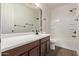 Bathroom featuring vanity with large mirror, and a shower-tub combo at 3595 E Desert Moon Trl, San Tan Valley, AZ 85143