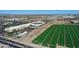 Panoramic aerial view of the commercial district, shopping areas, and flourishing green fields at 4100 S Pinelake Way # 143, Chandler, AZ 85249