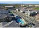 Aerial view of a well planned community featuring a playground, pool area, and tidy street layout at 4100 S Pinelake Way # 143, Chandler, AZ 85249