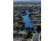 Stunning aerial view showcasing the community's lake and surrounding homes at 4100 S Pinelake Way # 143, Chandler, AZ 85249