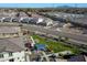 Bird's-eye view showcasing the community park and the surrounding residences with neatly planned streetscape at 4100 S Pinelake Way # 143, Chandler, AZ 85249
