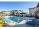 Inviting community pool area featuring lounge chairs, a jacuzzi, and shaded seating, perfect for relaxing outdoors at 4100 S Pinelake Way # 143, Chandler, AZ 85249