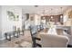 Inviting dining room features a large table, open floorplan, and seamless flow to the kitchen and staircase at 4100 S Pinelake Way # 143, Chandler, AZ 85249