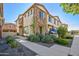 Charming townhome featuring stone accents and manicured landscaping at 4100 S Pinelake Way # 143, Chandler, AZ 85249