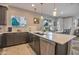Modern kitchen with stainless steel appliances and a breakfast bar overlooking the dining area at 4100 S Pinelake Way # 143, Chandler, AZ 85249