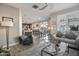 Open-concept living room showcases a seamless transition to the dining area and kitchen at 4100 S Pinelake Way # 143, Chandler, AZ 85249