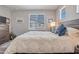 Main bedroom showcasing natural light and king size bed at 4100 S Pinelake Way # 143, Chandler, AZ 85249