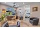 Spacious home office with a desk, TV, and a comfortable chair at 4100 S Pinelake Way # 143, Chandler, AZ 85249