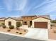 Beautiful home with a well-manicured front yard and a two-car garage at 41622 W Summer Sun Ln, Maricopa, AZ 85138