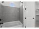 Bathroom with gray subway tile surround and tub with a shower at 4210 E Desert Vista Trl, Cave Creek, AZ 85331