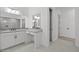 Bright bathroom with double vanity, white cabinets, and quartz countertop, creating a clean modern look at 4210 E Desert Vista Trl, Cave Creek, AZ 85331