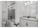 Bathroom with white cabinets, gray countertop, and a shower-tub combo with gray tile at 4210 E Desert Vista Trl, Cave Creek, AZ 85331