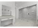 Luxurious bathroom showcasing a vanity and walk-in shower with stylish tile surround and glass enclosure at 4210 E Desert Vista Trl, Cave Creek, AZ 85331