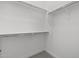 Spacious walk-in closet with metal hanging rods and white shelving at 4210 E Desert Vista Trl, Cave Creek, AZ 85331
