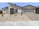 Single Gathering home features desert landscaping, gray exterior, and two car garage at 4210 E Desert Vista Trl, Cave Creek, AZ 85331