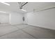 Bright and spacious garage with concrete flooring, white walls, and an installed garage door opener at 4210 E Desert Vista Trl, Cave Creek, AZ 85331