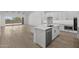 Spacious kitchen featuring stainless steel appliances, quartz countertops, and island with sink at 4210 E Desert Vista Trl, Cave Creek, AZ 85331