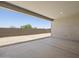 This covered patio features a concrete floor and block wall for privacy and shade at 4210 E Desert Vista Trl, Cave Creek, AZ 85331