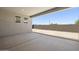 This covered patio features a concrete floor and block wall for privacy and shade at 4210 E Desert Vista Trl, Cave Creek, AZ 85331