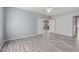 Spacious bedroom with lots of natural light, ceiling fan and wood flooring at 43608 W Kristal Ln, Maricopa, AZ 85138