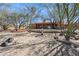 View of backyard with desert landscape featuring a patio and the exterior of the house at 43638 N 22Nd St, New River, AZ 85087