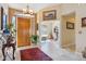 Welcoming foyer featuring a decorative rug, tiled floors and ample natural light at 43638 N 22Nd St, New River, AZ 85087