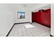 Bright bedroom features a modern ceiling fan, natural light, and clean white tile flooring at 5222 S 5Th St, Phoenix, AZ 85040