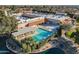 Aerial view of a community center with a sparkling pool, lounge areas, and recreational facilities at 54 Leisure World --, Mesa, AZ 85206