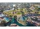 Aerial view of a community featuring a golf course, tennis courts, pool, and lake at 54 Leisure World --, Mesa, AZ 85206