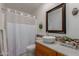 Bathroom featuring granite counters, mosaic backsplash, vessel sink, decorative wall hangings, and shower with curtain at 54 Leisure World --, Mesa, AZ 85206