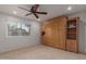 Bedroom featuring a ceiling fan and a Murphy bed with built-in storage at 54 Leisure World --, Mesa, AZ 85206