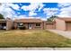 Charming single-story home with a well-maintained lawn and attached garage, perfect for comfortable living at 54 Leisure World --, Mesa, AZ 85206