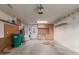 Spacious garage featuring workbench, cabinets, utility sink, shelving, and laundry hookups at 54 Leisure World --, Mesa, AZ 85206