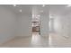 Open living space with tile floors leading to the kitchen, featuring recessed lighting at 54 Leisure World --, Mesa, AZ 85206